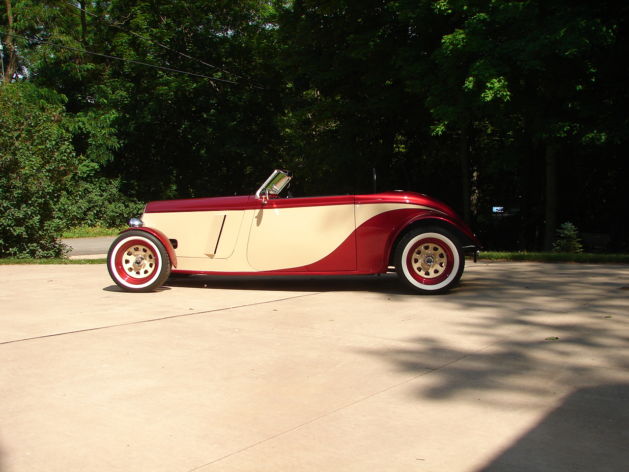 2012 Photo in Roadster trim - Side View - To create the vents we laid out a parallelogram that followed the rear edge of the engine panel and sawed it out. We then glassed it back in with about 1" of opening at the trailing edge.