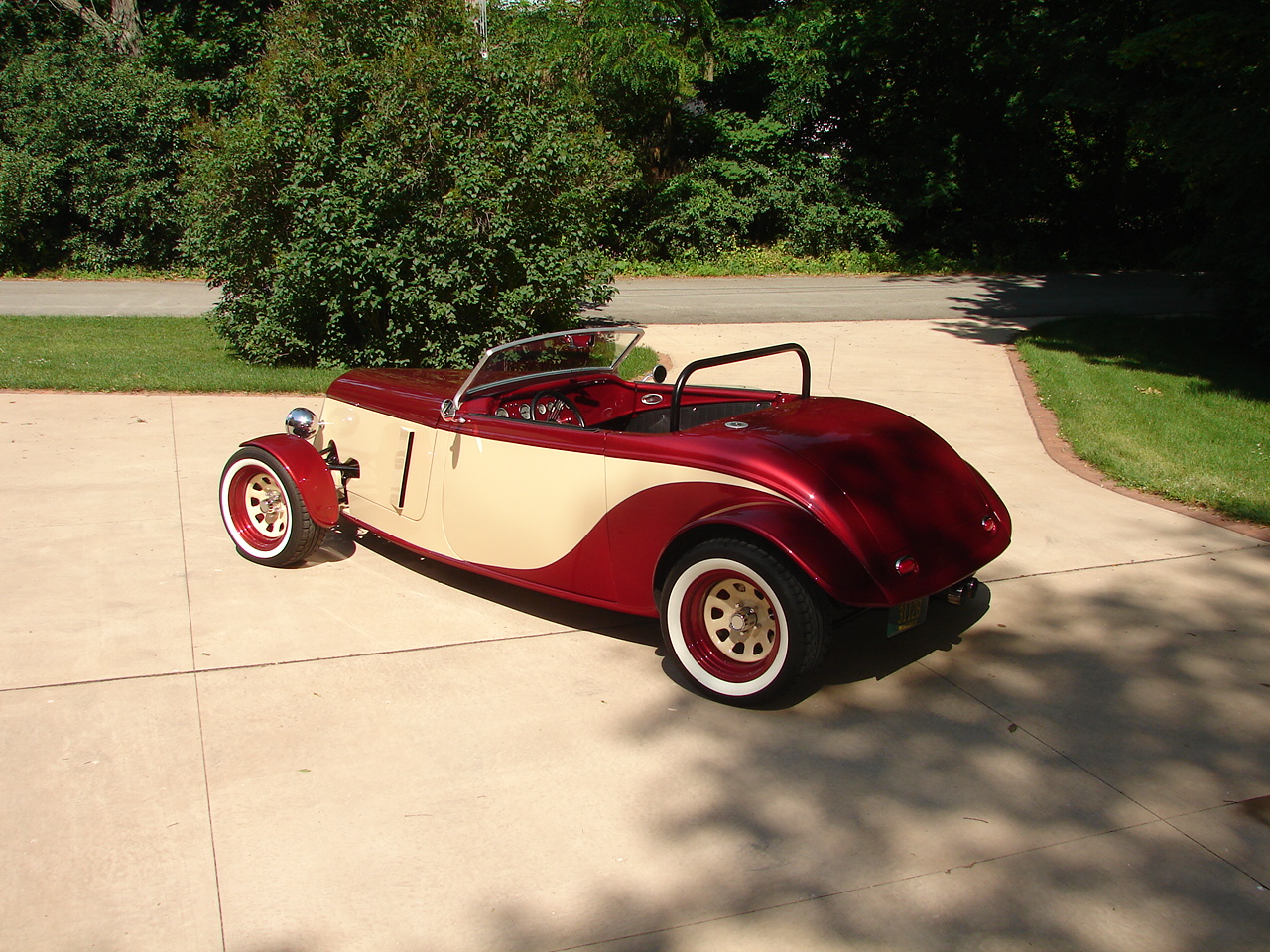 2012 Photo in "Roadster" trim - Rear Quarter View - Here you can see the side panel vents that were cut in this winter. This simple modification helps to keep the foot well cooler as well as the engine bay.