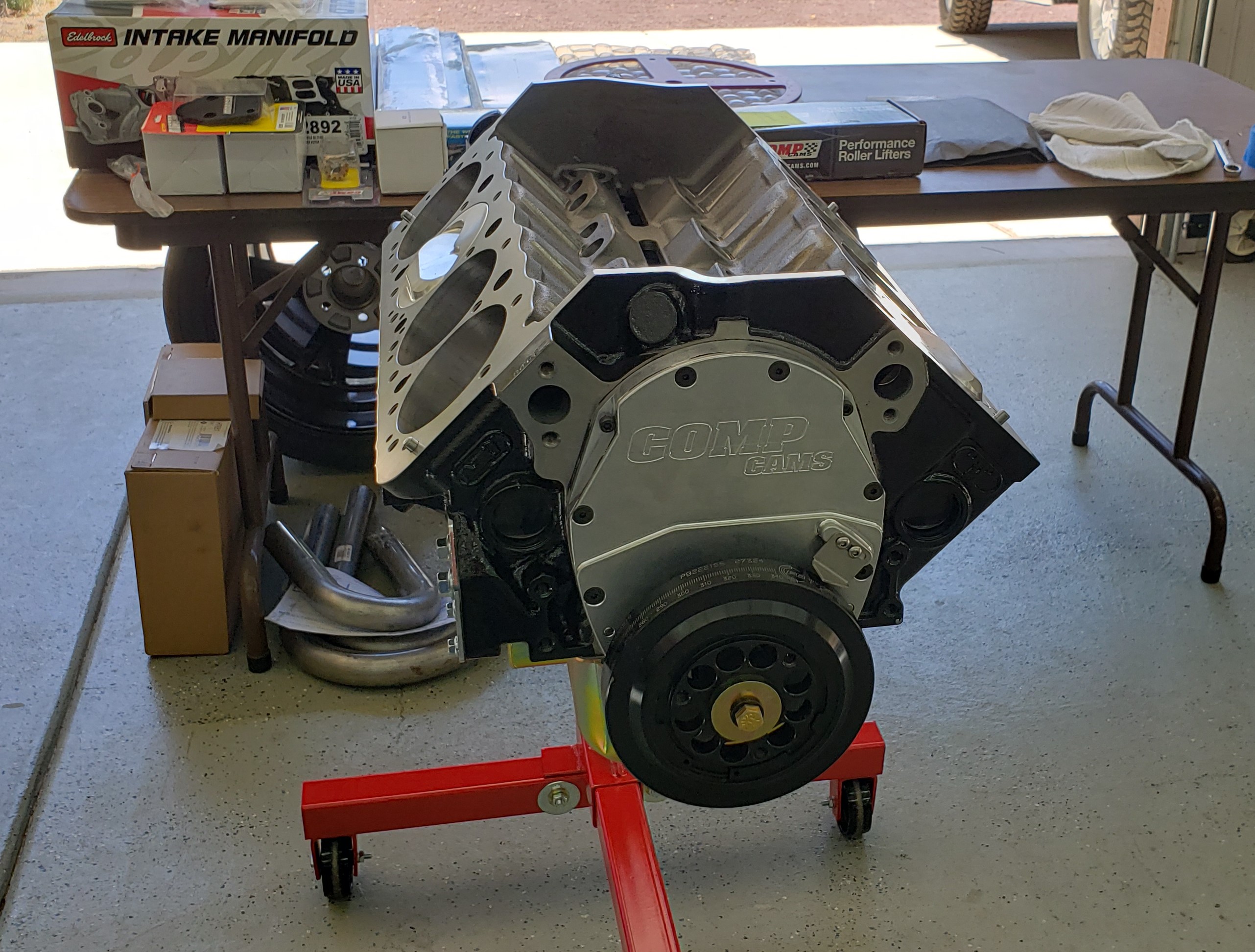 406 Short Block -- Dart Little M race block with splayed caps, Manley non-twist crank - 3.750" stroke, 6" Molnar H-Beam turbo rods with ARP 2000 asymmetrical rod bolts, JE 2618 forged alloy nitrous compatible pistons - 4.155" bore &  1.125" compression height (deck set for 13:1 compression ratio), chrome alloy pins, Total Seal TNT nitrous rings, Clevite 77 "H" series bearings, COMP Cams small base circle mechanical roller cam (special ground to my specs) with over .700" lift. That's a lot of lift for a SBC.   I developed the cam profile using COMP Cams modeling software which allows an infinite number of cam profile changes to test on the computer.

Why a 406 CI -- why not a 434 CI?  Before purchasing all the parts I ran several iterations of SBC engines on my engine modeling program and the shorter crank 406 allowed for a better rod ratio with the thicker nitrous pistons.  The 406 makes more peak HP than the longer stroke 434 due to significantly less piston friction and will be easier on pistons, rings, bores, and rods. 

Modeling shows this engine will produce peak torque of >600 at 5500 and peak HP of 800 at 7500 and that's without nitrous.  The VE is >100% from 5000 RPM thru 80000 rpm Red Line with a peak of 120%.  With a 300-shot of nitrous the HP tops out at >1100 and will propel my car quicker than the 8.5-sec certification on the chassis so that much HP is not an option on an NHRA track.

 The rotating assembly is rated for 1500 HP but I won't use near that much nitrous so the engine is built with a significant safety margin.  




RIGHT CLICK THEN CLICK VIEW IMAGE