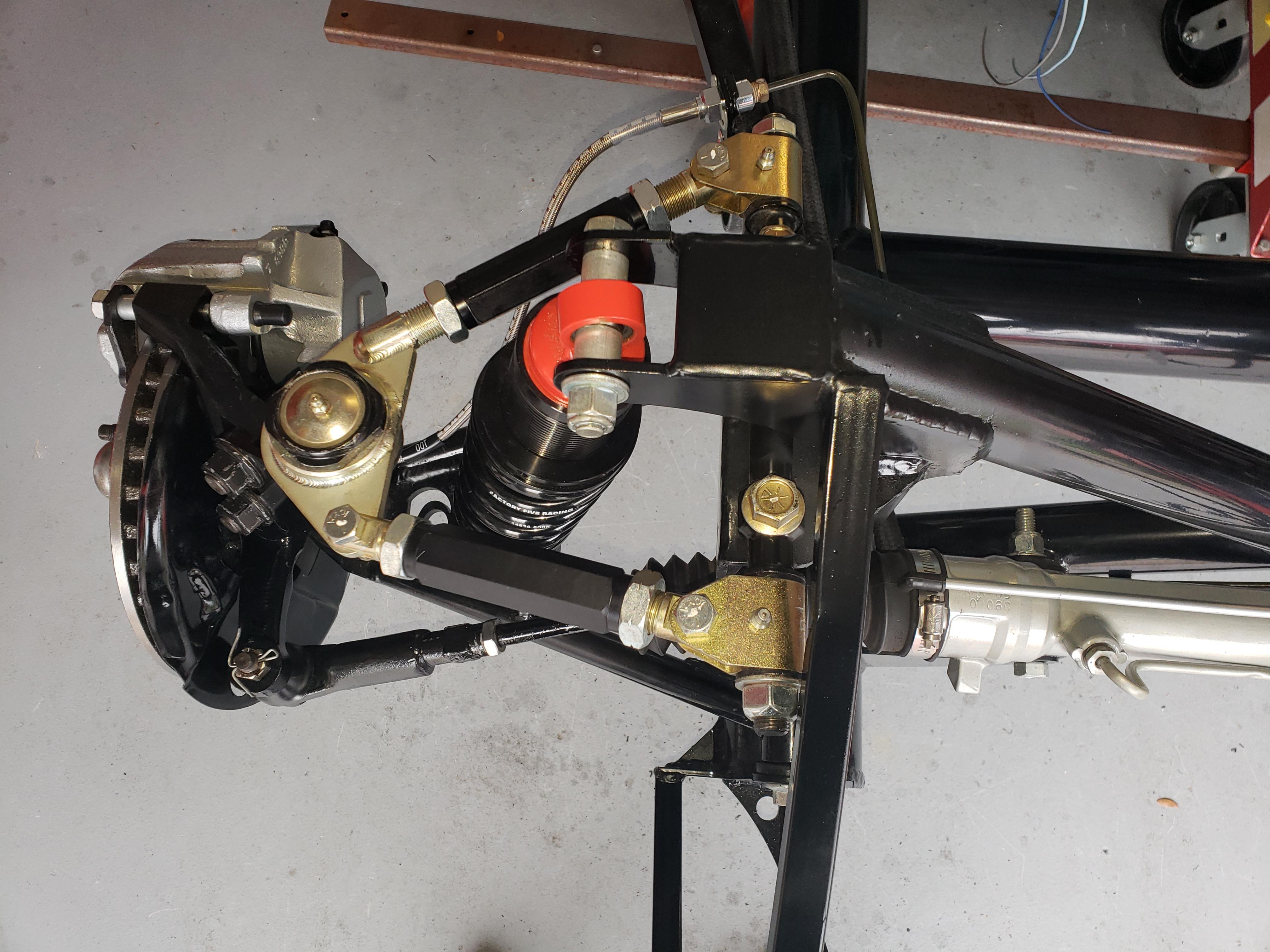 Passenger side upper control arm fitment