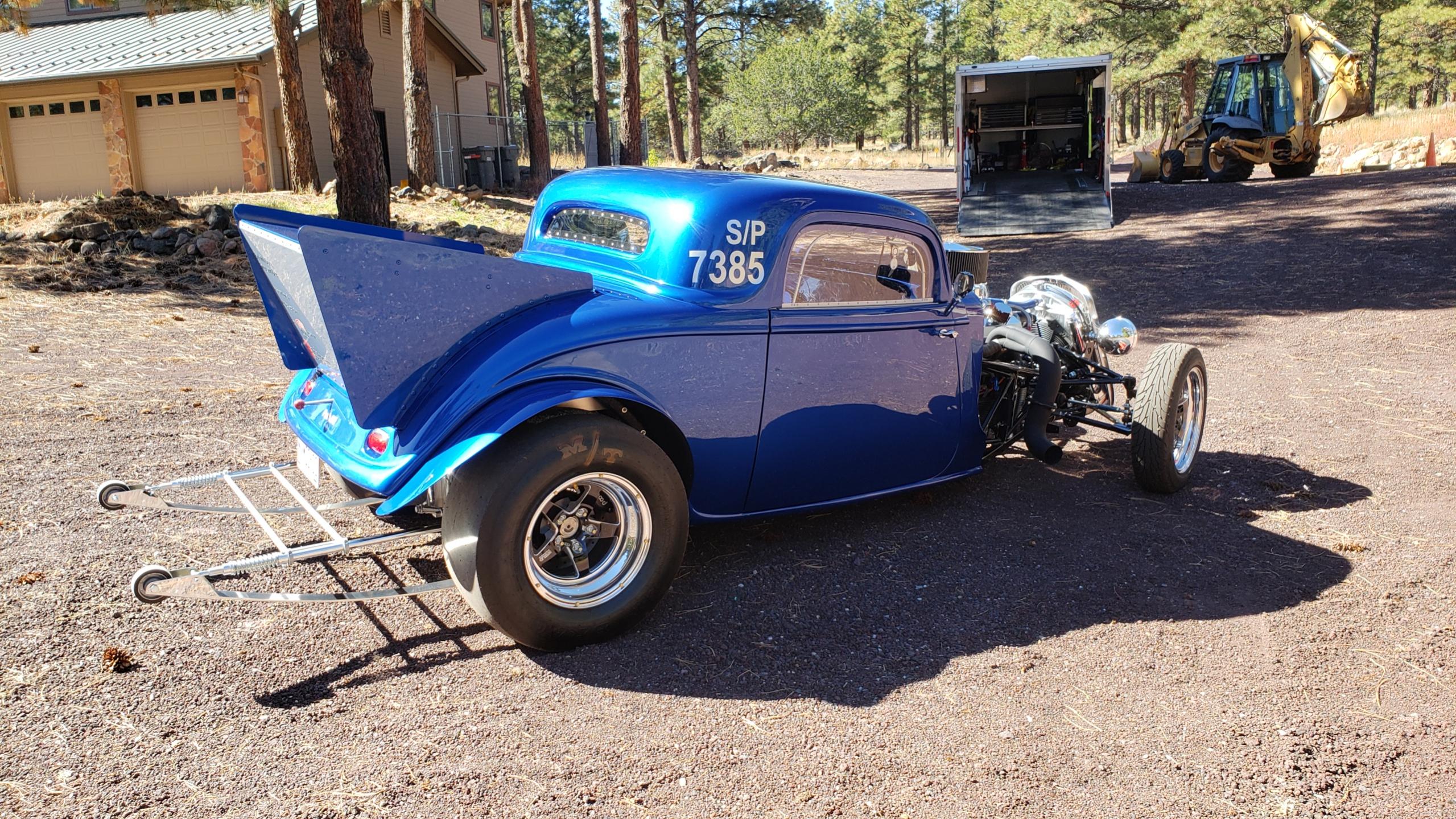 Right click and select view image.

MOCK 33

This fiberglass bodied replica 33 Ford was built to compete in NHRA Super Pro and is based on a Factory Five Racing body and front chassis section.  

A street legal race car, it�s a modern day tribute to grassroots drag racing from the 50�s & early 60�s when these model cars were popular.

Fast Facts:
* Built on the principle that form follows function  
* The roll cage / tube chassis is NHRA certified to 8.5-sec 
* Weighs 2292 lbs with 49% on the front & 51% rear
* Powered by a 1,100+ HP 406 Small Block Chevy �nitrous� engine
* FTI �Glide� 2-speed with trans brake, 1.8:1 1st 
* Hughes Pro 9� converter, 6000 stall speed
* Offset parallel four-link rear suspension with watts link
* QA1 double adjustable coilover shocks front & rear
* >3,700 hours & 1850 beers to complete not counting the paint
* Cost >$100K to build, more than $94K in receipts for parts and materials
* Very high-quality innovative build with nothing but the best go-fast parts
* All new construction, no used or refurbished parts -- even the engine block & rear axle housing are new aftermarket items