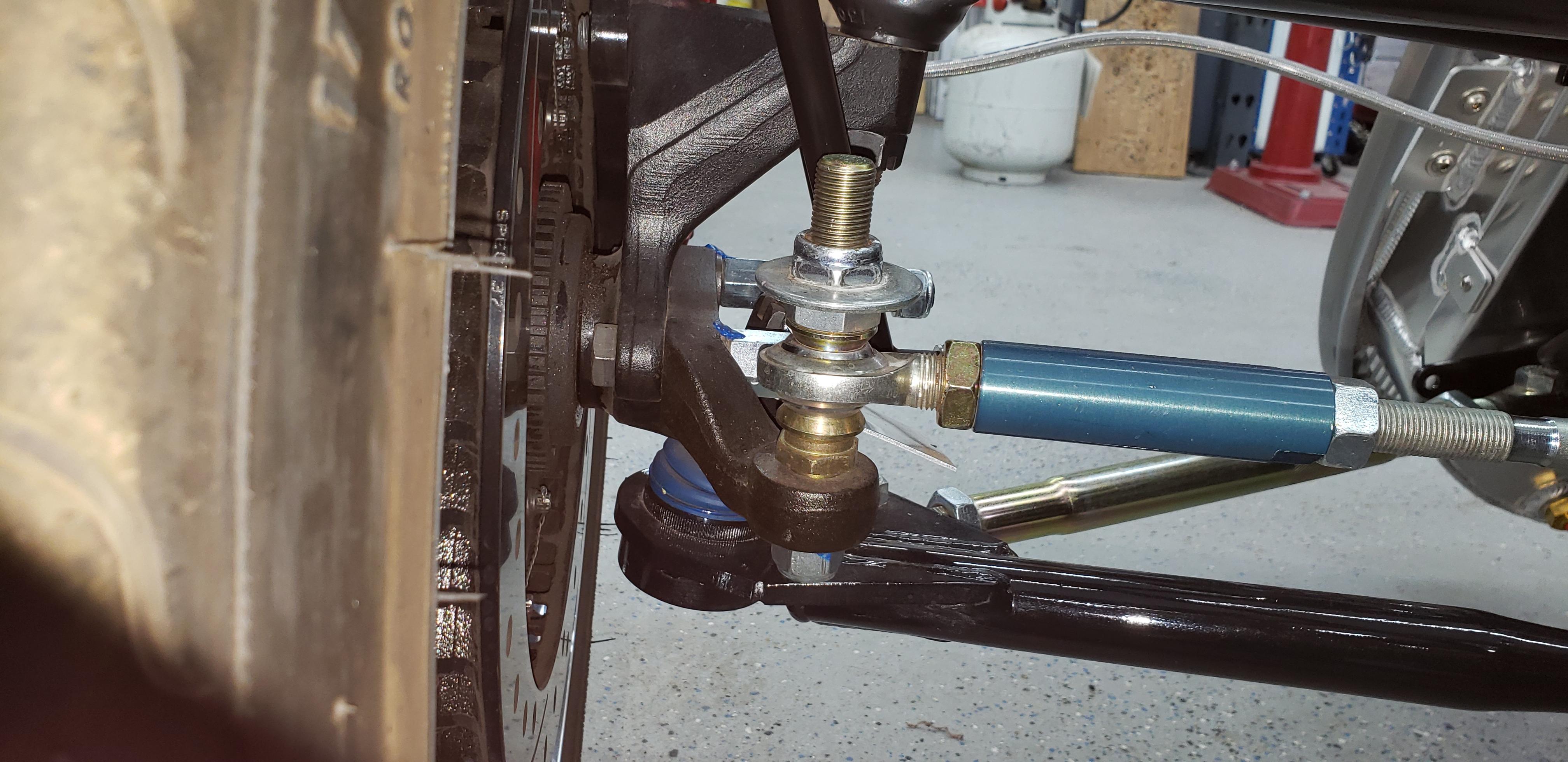 Modified FFR Bump Steer Kit #27593 with Adjustable Pinto 7-deg taper tie-rod to heim joint adapter #91636055-PINTO, 5/8" ID steel cone heim joint spacers from Speedway Motors.  The taper style heim joint adapters are much more secure than the FFR non-tapered style.

Note the large diameter flat washer to prevent a failed heim joint from separating leading to loss of control.  Many  sanctioning bodies require this as does the NHRA. 

Right click and select view image.