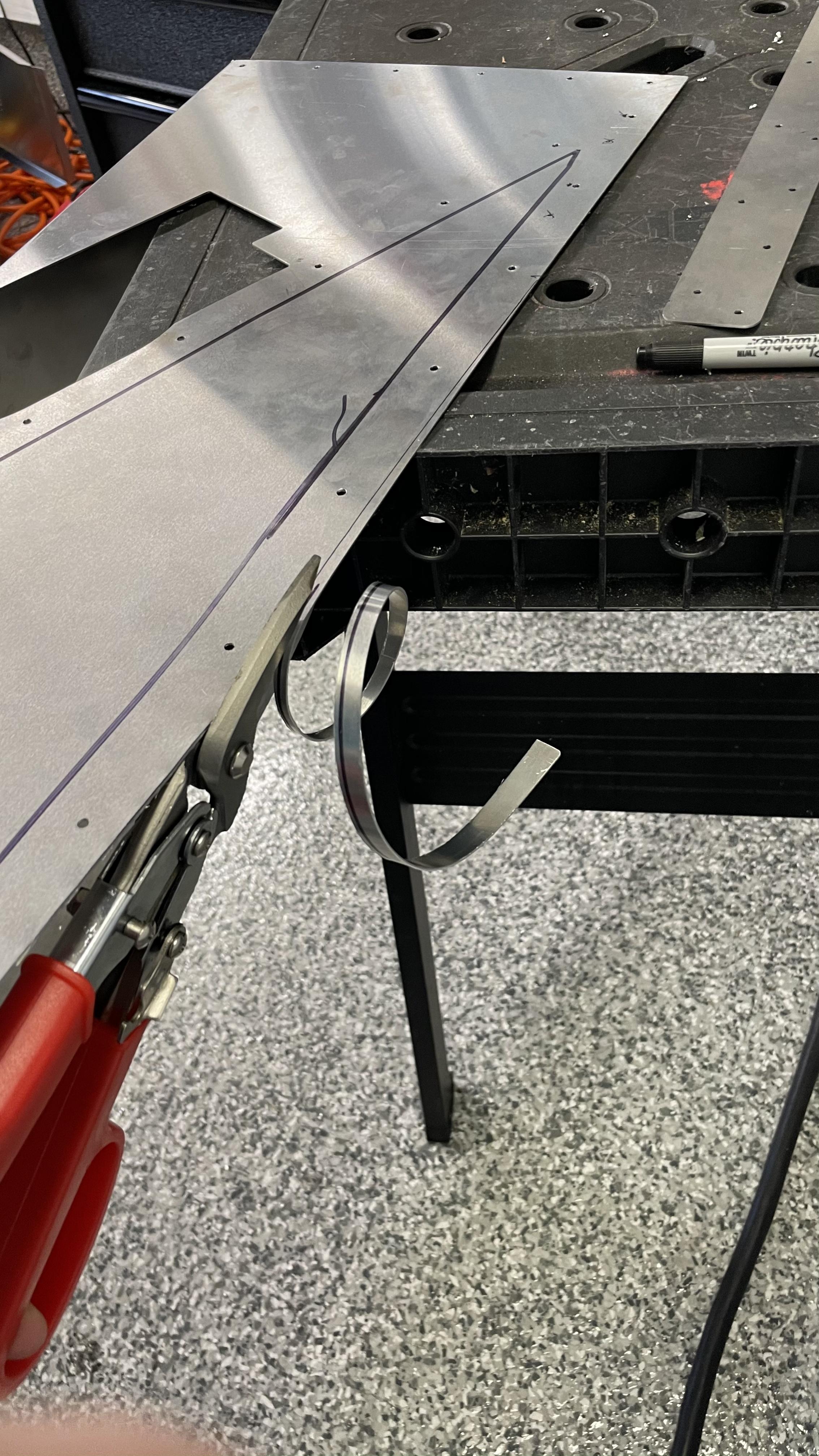 Trimming sheet metal
