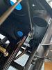 Rear brake line inside DS footbox looking down