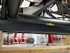 Rear brake line under DS footbox