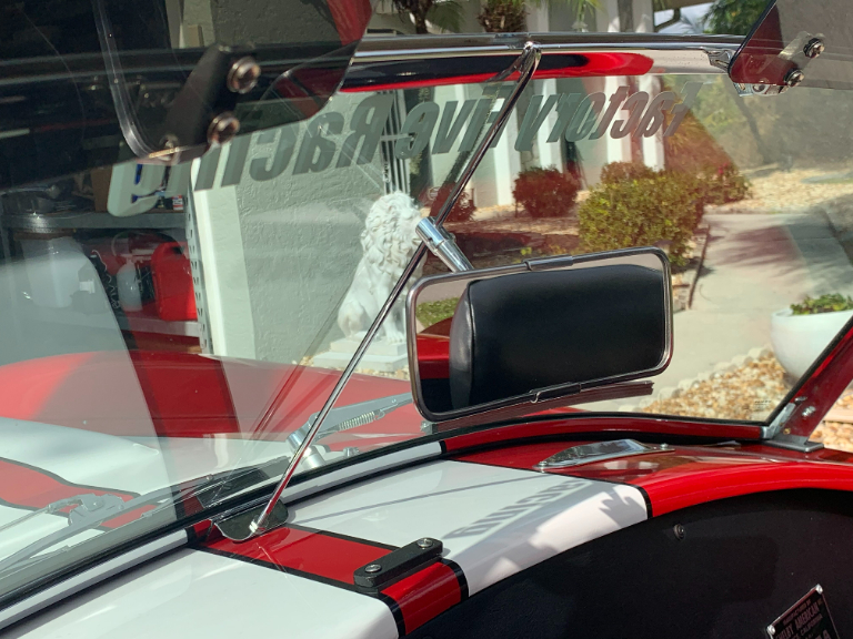 Windshield support and rearview mirror. Body shop was supposed to fill in the holes where the mirror was.