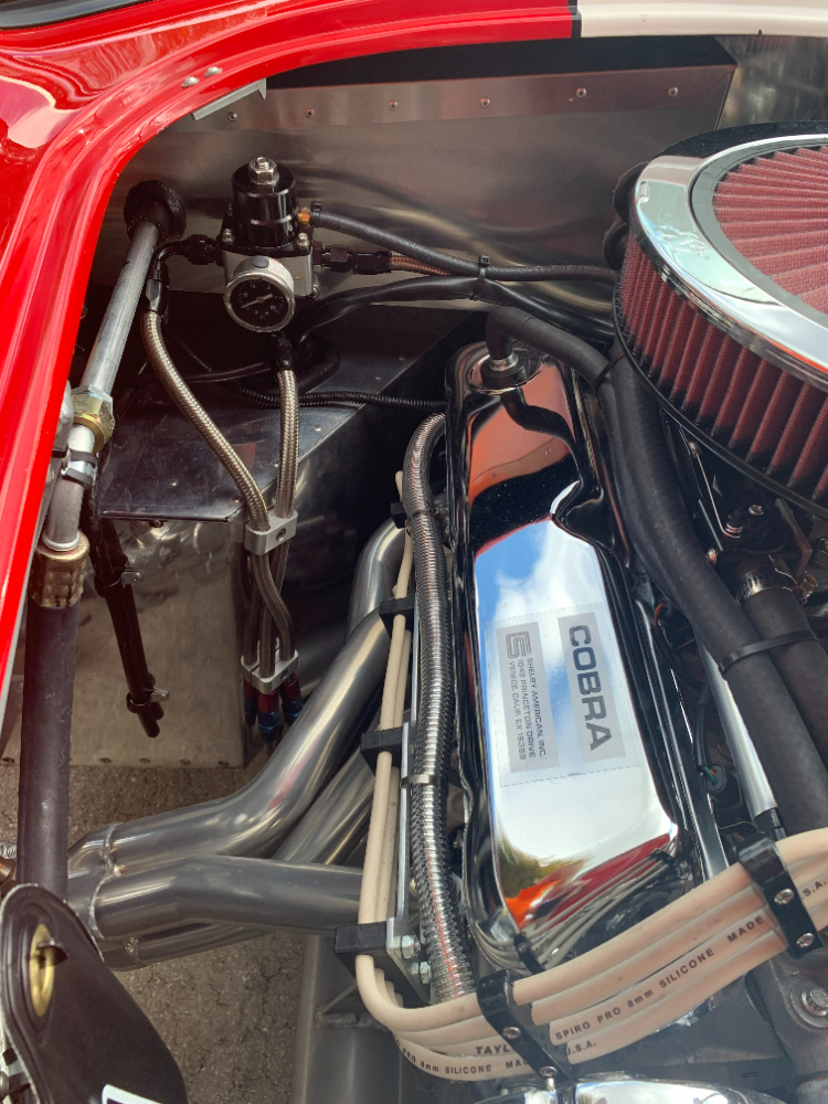 Fuel pressure gauge and sparkplug wiring.
