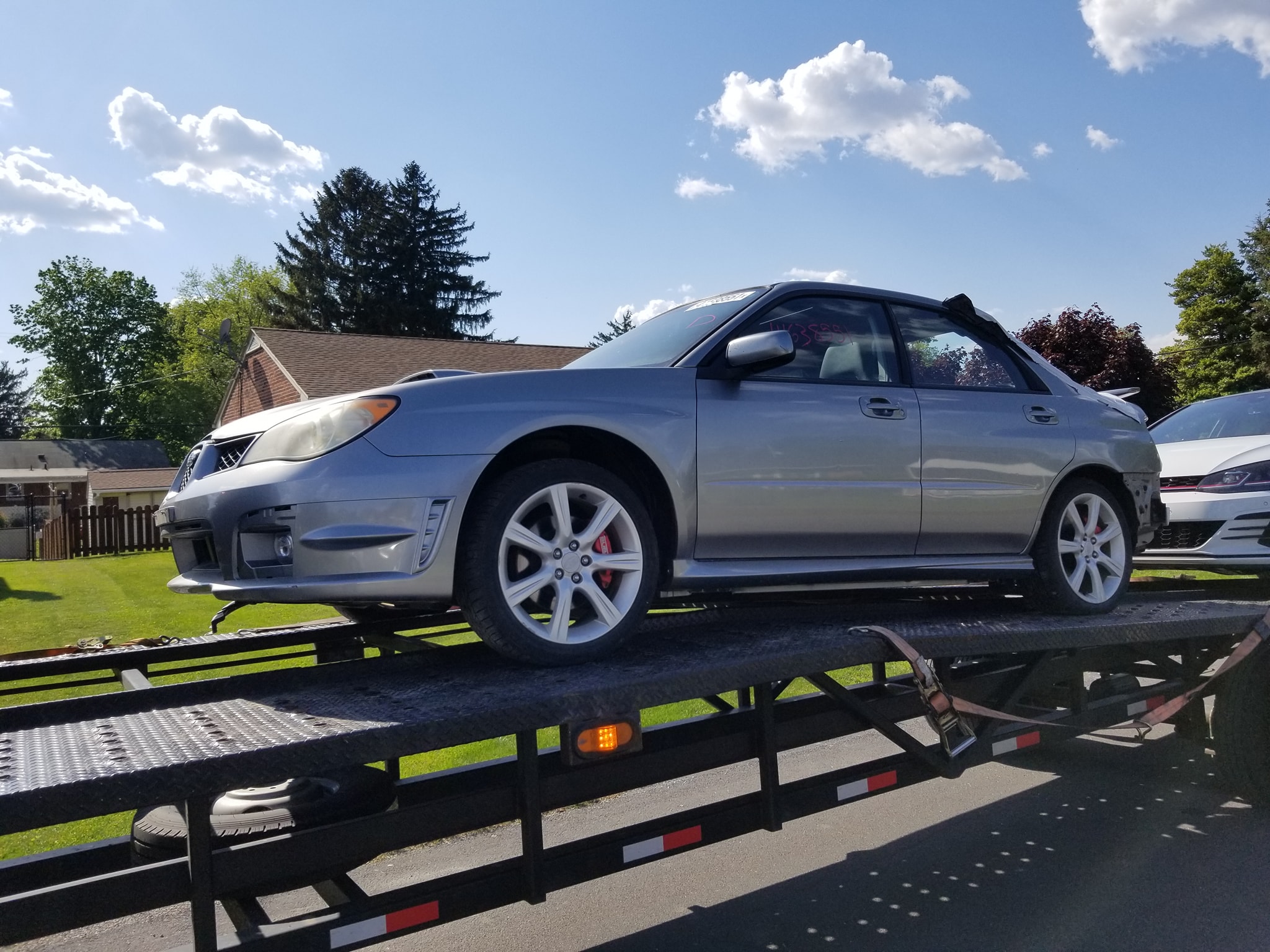Unloading her from the trailer.