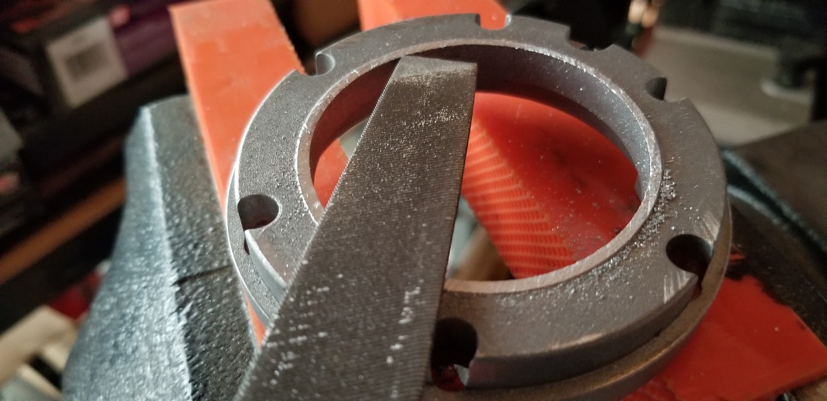 20210313 - I purposely cut it this way. I wanted to file it down totally flush and didn't want to scar the back with the hacksaw blade.