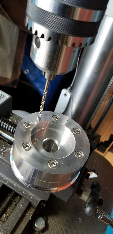 20210317 - The first hole to be drilled-out.  Make sure your vice has the part nice and snug/tight, without damaging the aluminum hub.
*NOTE:  I'm not sure I would try this mod without using a drill press?*