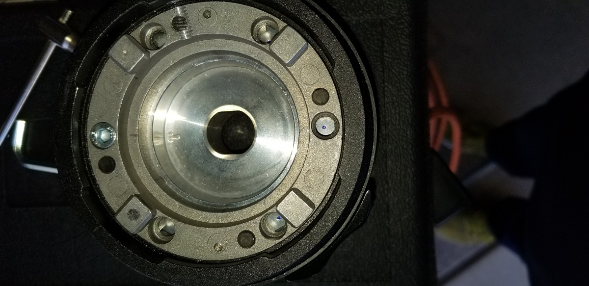 20210317 - Preparing for holes 2 thru 6 to be drilled.  1st hole already drilled and tapped using the [T] on the left, but which is straight up normally our found in the 12 o'clock position.  
*NOTE: The threads you see in the top are from the set screw that I drilled*