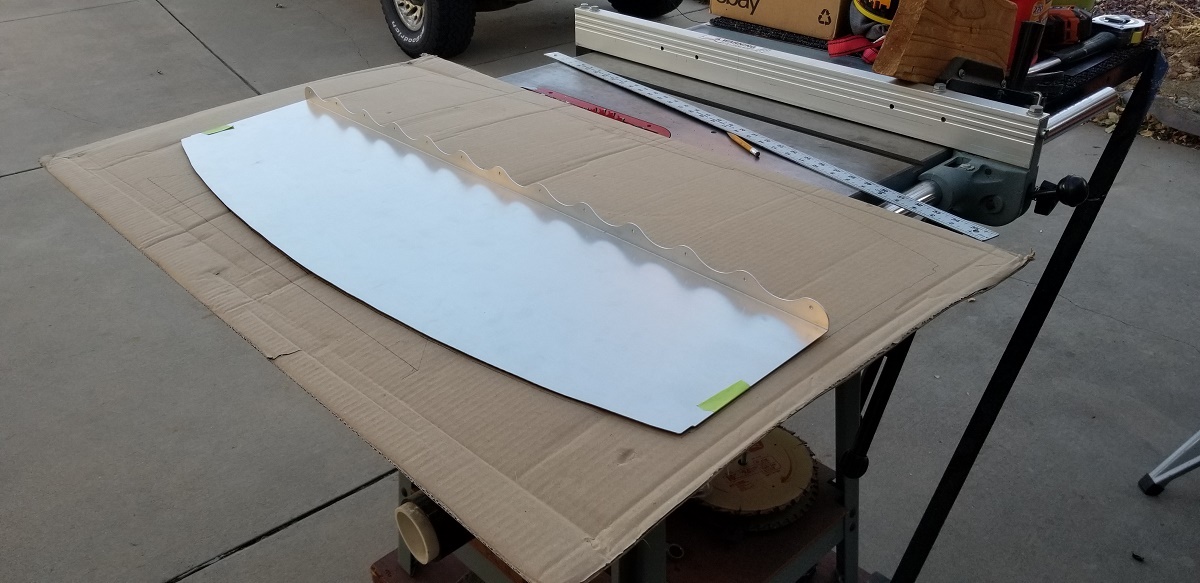 20211129 - I was pondering the design idea further when I took this pic.  I decided that I would incorporate all the wavy lines on trunk side of the hinge attaching to the cubby wall.  It should look cool!  I just need to cut it straight and not damage either piece.