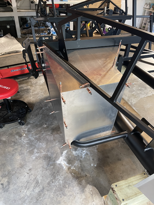 Passenger foot box drilled