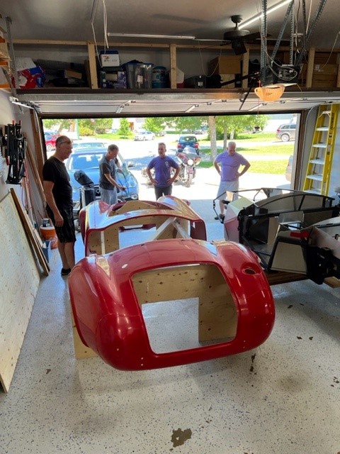 Body off chassis and off to it's storage location so I have more room to work.  leaving the chassis on the rolling frame to make it easier to move around till it outgrows the wooden frame.  Made a few measurements on the fibreglass around the dash hoop and the rear wall for gap.  I see were that can come in handy with preliminary body prep.  Thanks Paul!