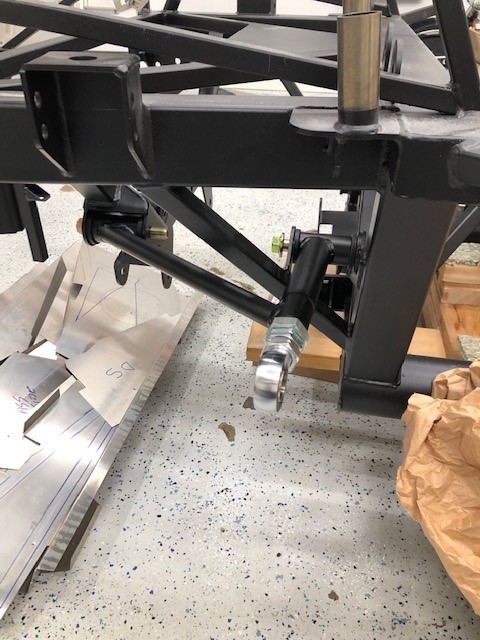 Took the opportunity to grease and loose fit the rear upper arms - no nuts to tighten them but the tabs they fit in were very tight... the holes to pass the bolt through were off a little too - took a little persuasion to get them in, I have heard this mentioned in threads before but first time experiencing it.    Missing parts from lower arms and toe adjustment but I really didn't want to go too far in here anyways considering the rear end has got to go in yet.  Lots more to pick away at to keep me busy till more arrives.