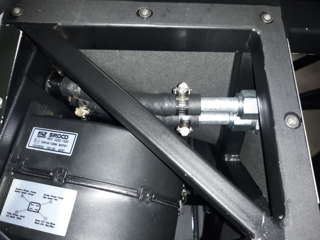 Heater hose in footbox