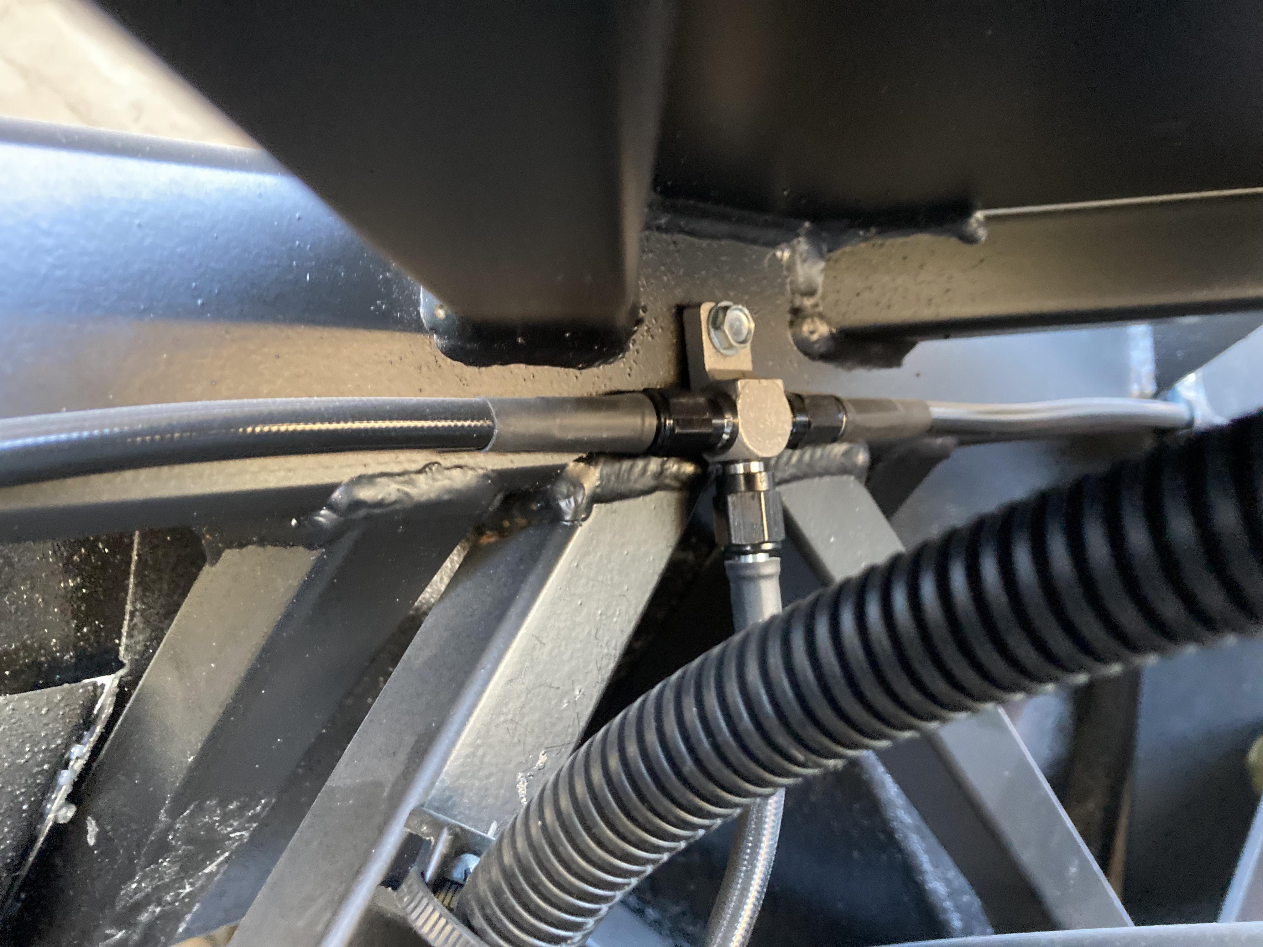 rear brake line a cross member