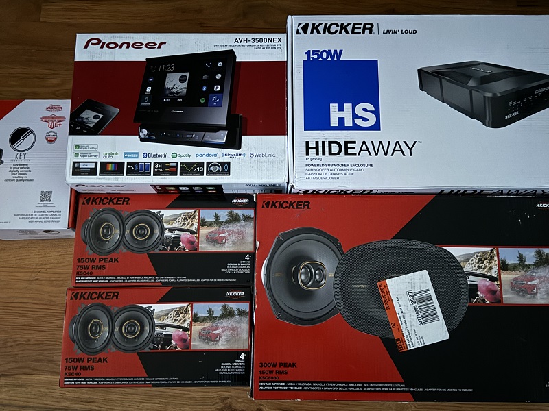 Terrible photo!  I decided to go with Pioneer and Kicker.  I'll be putting in a 4channel system and I cut-off the Kicker amp on the left with another still be ordered.