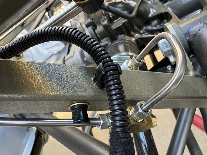 Passenger side e-brake wire clipped-in.