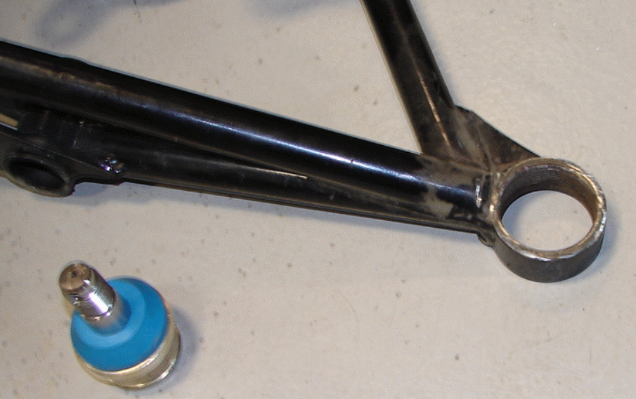 Upper Arm and Ball Joint Replacement - We cut down the existing collar a bit and will be welding on a new one. Since the two ball joints install differently (screwed in vs press fit) and the height to the shoulder is a bit different the new collar will make up the difference keeping the upper and lower arms at the same separation.