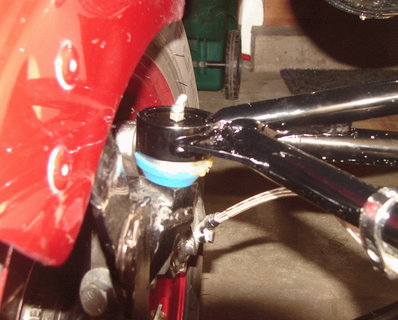 Ball Joint - from back side. Grease fitting is on top. About 1/8" of dish remains between the top of the pressed in ball joint and the top of the collar.
