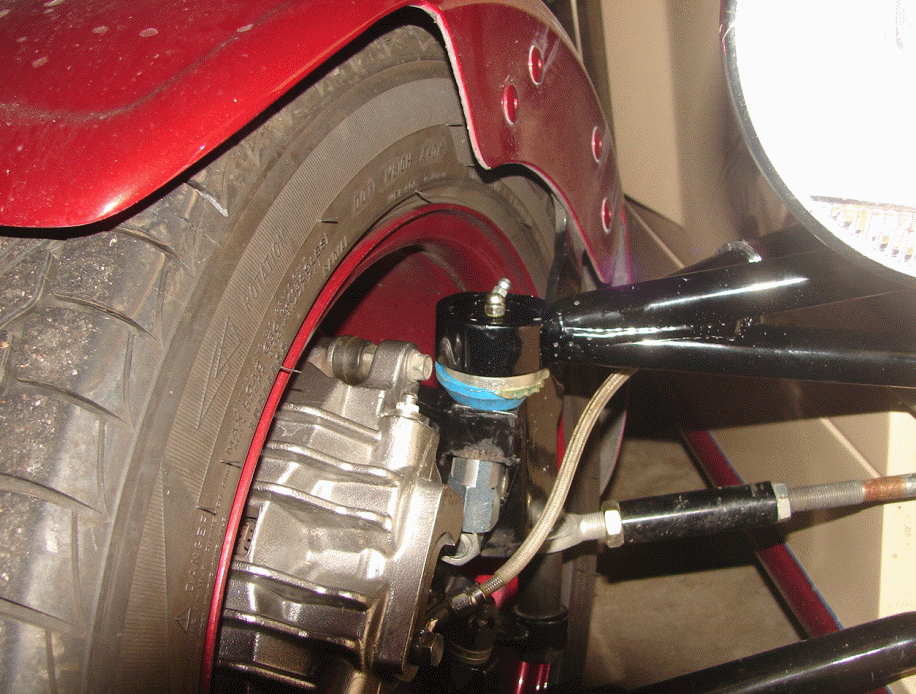 Ball Joint - from front side. Note the depth of the collar is about the same as stock. We bored out the threads, machined an insert and welded it in place. Then the new press fit ball joint was fitted to the new collar.