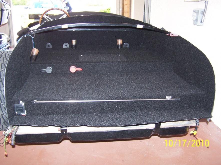 Trunk area done with trunk prop rod & remote battery terminals.