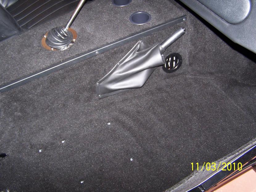 Carpet installed with cup holders & air vents installed.