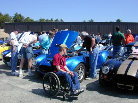 At one of the early open houses back in 1990 Jake came along for the trip - he loves to ride - and his wheel chair disassembled and fit completely in the trunk except for one wheel which we tucked between him and the passenger door.