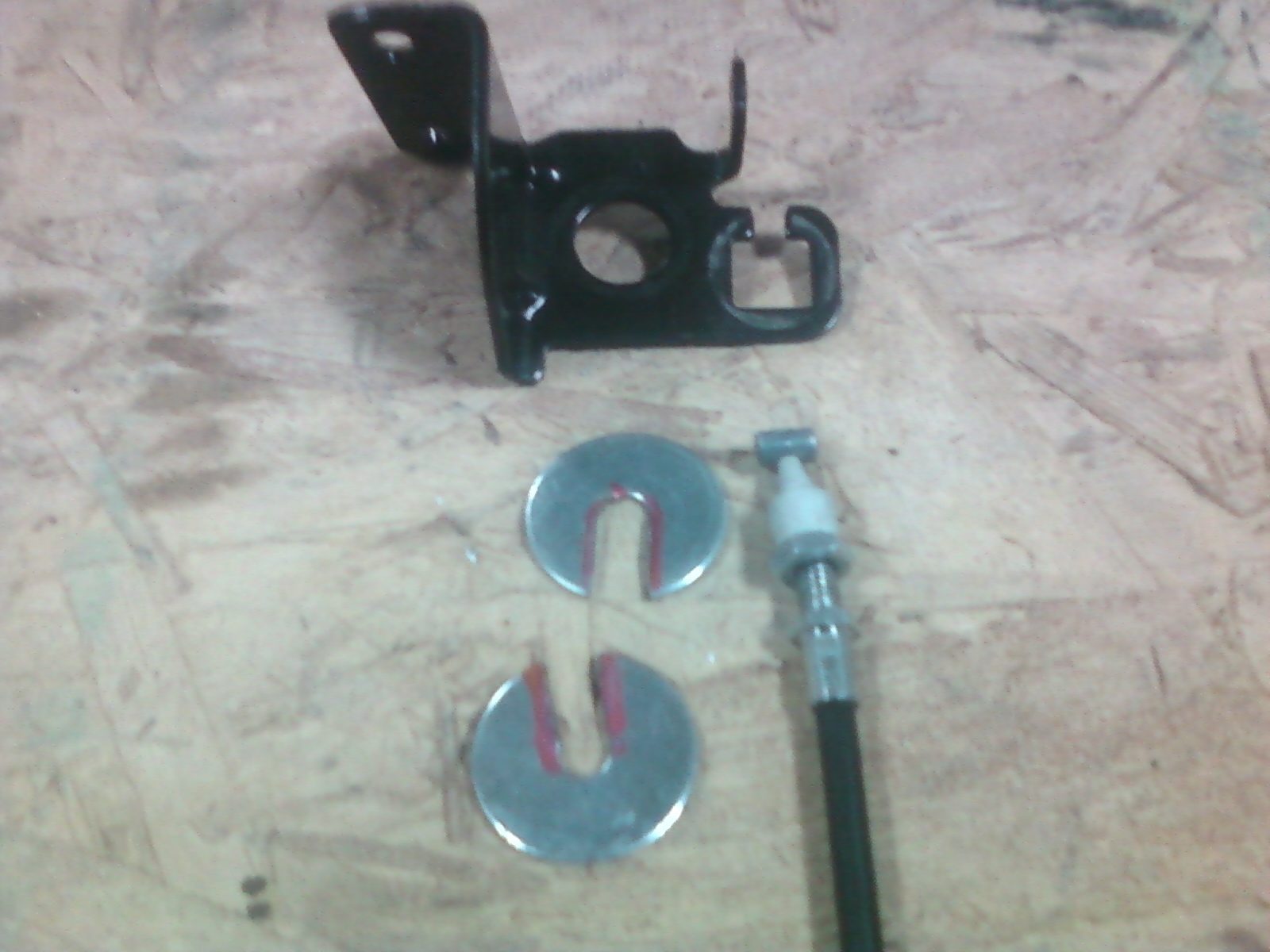 Adapters made from 1/4" fender washers for FFR supplied throttle cable