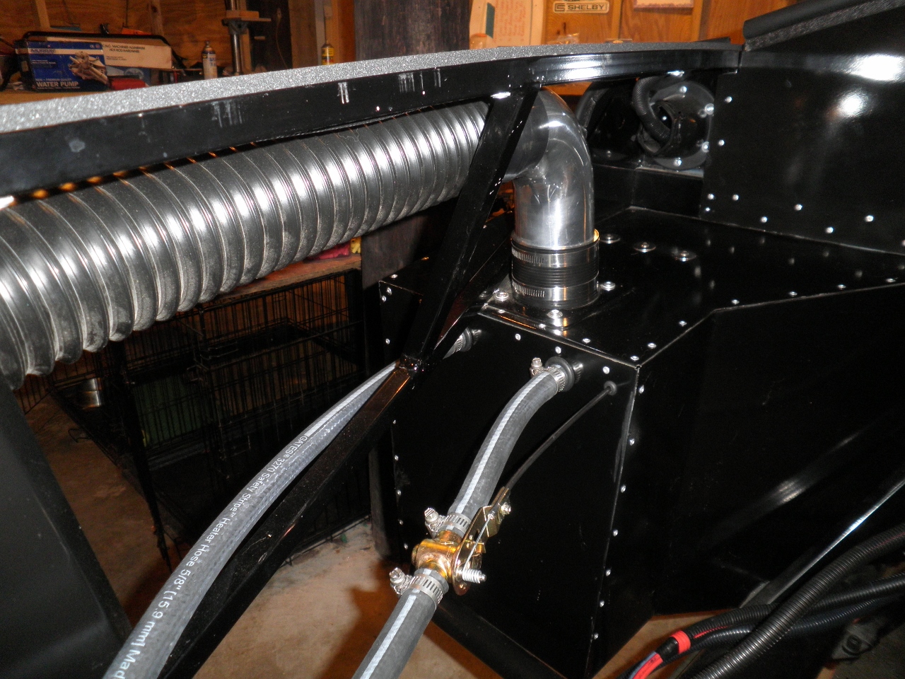 View of passenger heater from the front of the chassis.   Notice the four season's mechanical heater valve that is operated by a choke cable.