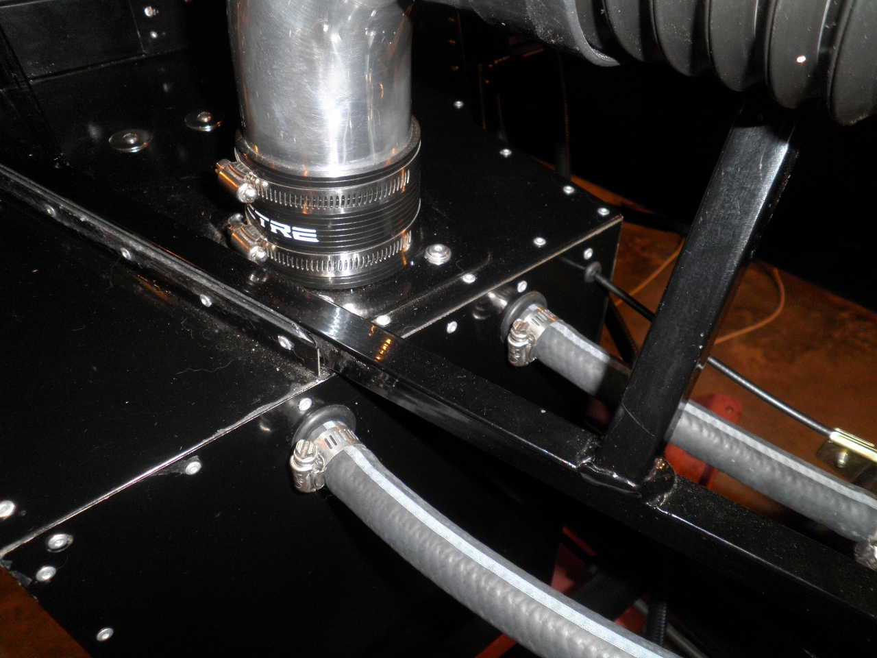 Close up view of air inlet and water routing.