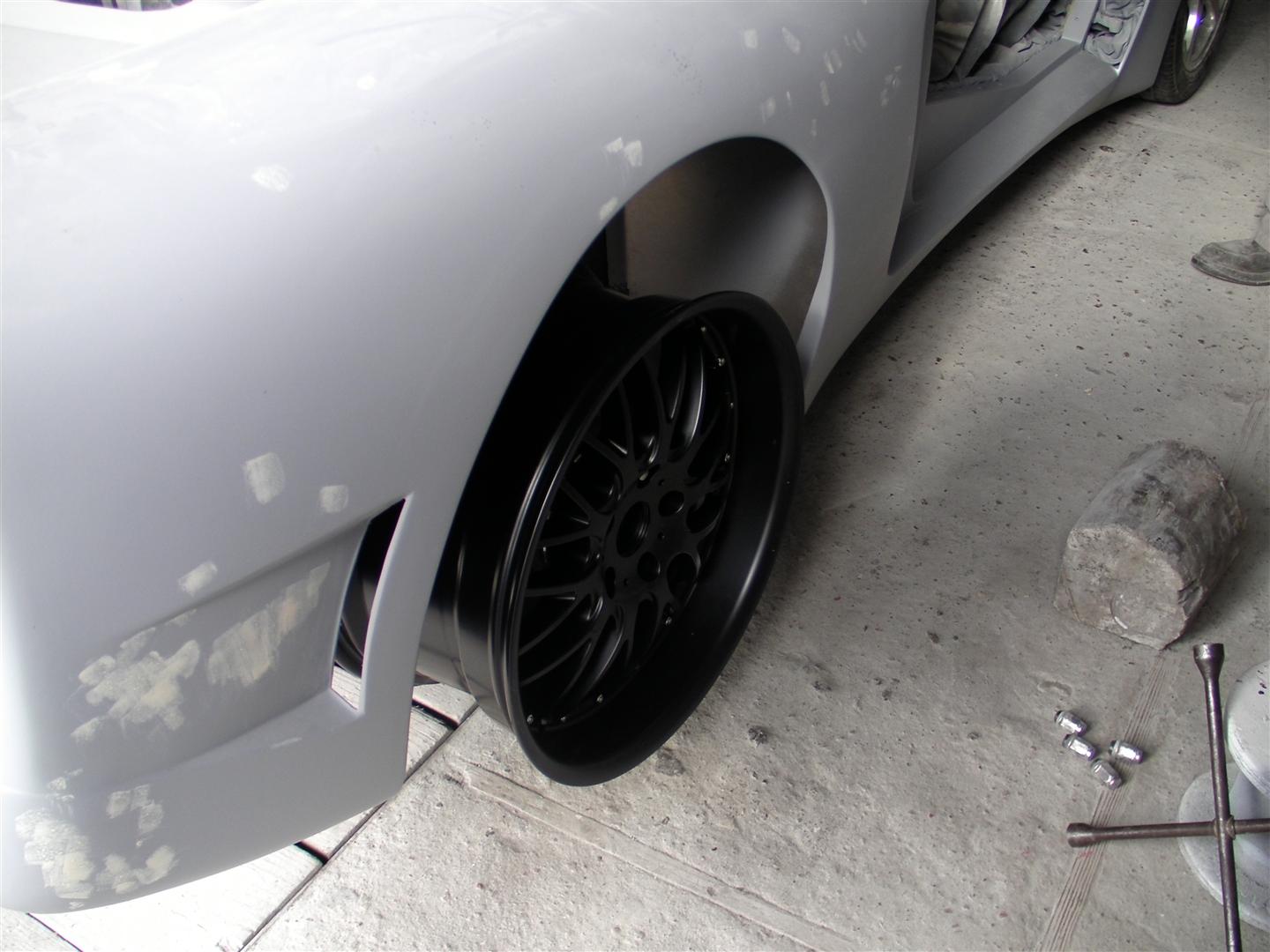 Rear fitment test with the spacer. Will probably have to remove it or shave it down.