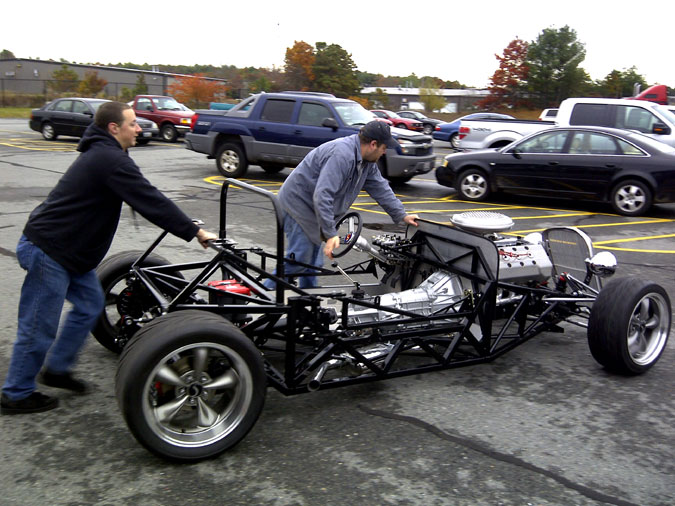 Briian and Jim push the Hot Rolling chassis back into the building.