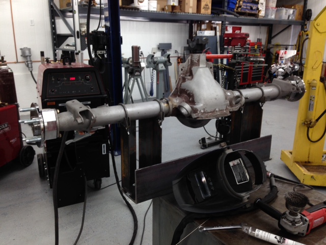 Axle welding jig and special welding process prevent warped housings.