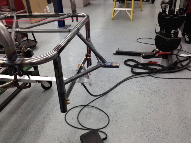 Parachute mount being fabricated.  Chute manufacturer says expect 2-g's of negative acceleration when chute deploys.  Additional tubing tying the mount into the main hoop not yet installed.