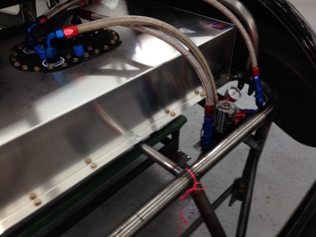 Test fitting the fuel pump and making fuel lines.  The Quickfuel 30-175 electric bypass fuel pump provides 125 GPH @ 18 PSI and up to 200 GPH flow of fuel to the carb depending on demand.  Enough to feed the engine even under more than 2-g's of acceleration.  Will feed the carb through a bypass regulator mounted near the carb returning extra fuel back to the fuel cell.