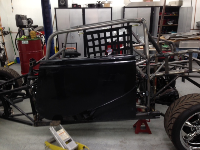 Test fitting door hinges.  Due to the compound curves and angles of the roll cage, fabricating mounts to accept the original FFR hinges was the next hardest thing to design.  It took two iterations to get it right.