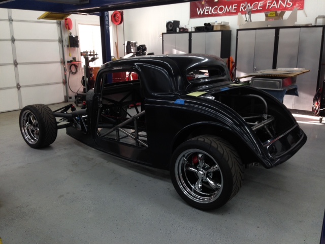 Body sets ~1" higher in rear to clear roll cage main hoop rear braces which NHRA requires 30-degrees minimum