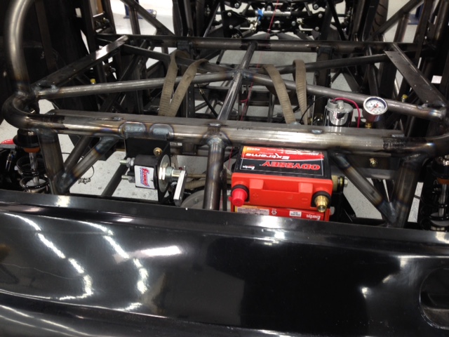 Fitting battery & master cutoff switch.  Master switch is a push/pull type and will have linkage running through the body and exiting under the parachute mount to comply with NHRA rules.