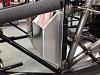 Made a bulge on the driver's side lower firewall to provide room to locate the pedals 5" further forward than the original FFR design.