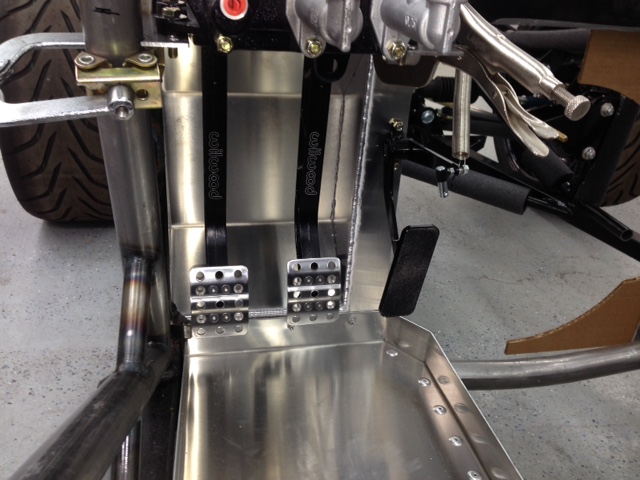 New floorboards are wider and lower than FFR originals; driver's side is 3" lower and passenger side 2" lower.  The fuel lines, electrical, and the rear brake line all run under the passenger floor so that floorboard is set with an extra inch of clearance under the floor.