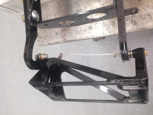 Back on the door hinges and making them fit the new chassis.  Modified the FFR hinge on the driver side to make the door lift off.  Machined a couple of pins, replaced door bracket bushings with one-piece style, and added a pull pin to prevent the hinge from separating until ready to lift off the door.