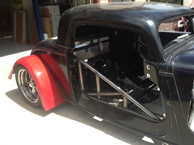 Also test mounted rear fenders to measure how much has to be cut to fit MT Drag Slicks.  The low-growth bias ply 28" diameter drag slicks will grow ~1" at 150 MPH so I'm making room for 30" tires.  That should be plenty of room for the bias ply drag slicks and even 30" radial drag slicks (radials don't grow).  If I have to go bigger than 30" the rear fenders will have to be removed and the gear ratio changed so that's not likely to happen.