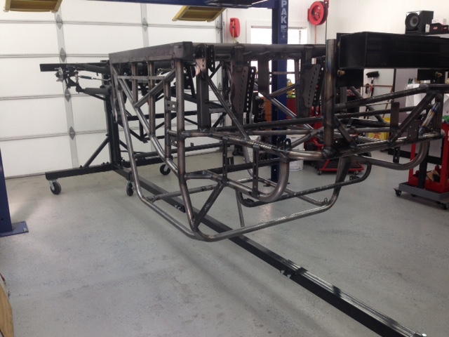 Chassis inverted on the rotisserie ready to bead blast.  Now I'll simply roll it outside to blast so I don't make a mess in the shop.