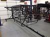 Chassis inverted on the rotisserie ready to bead blast.  Now I'll simply roll it outside to blast so I don't make a mess in the shop.
