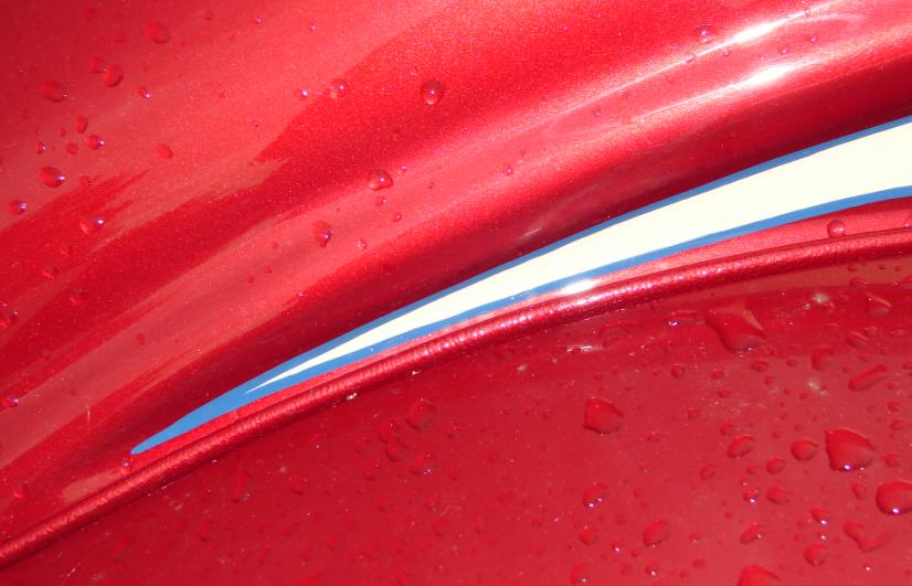 This photo shows the pinstripe detail as well as the fabric "welt" that separates the fender from the body wheel well. Welt is "period correct" for a '33.