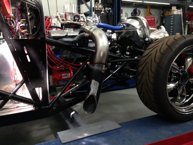 While waiting on parts for my switch panel I jumped on the headers and mufflers to finish them off and send to the coater.  Had to modify the right side header to make room for a safety tube to run the front brake line through (NHRA requirement).  Also need to finish the shortie mufflers.