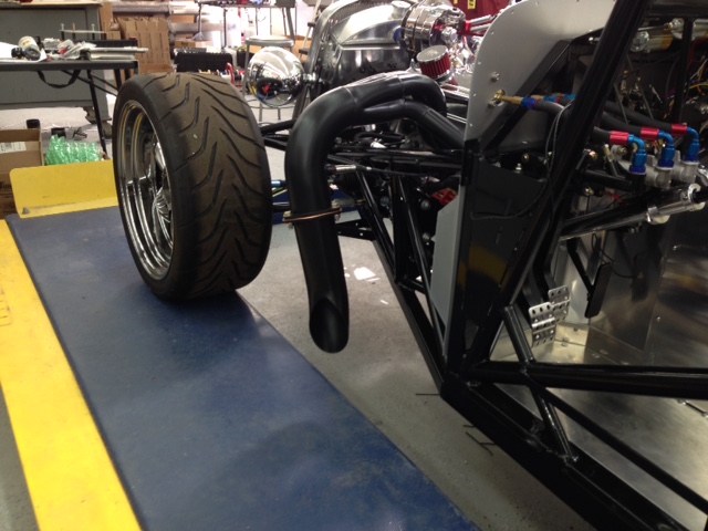 The slash cut mufflers exit in front of the doors.