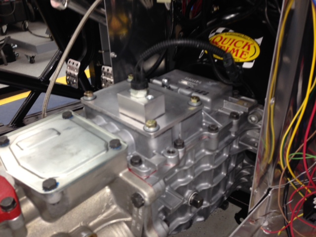 Before buttoning up the doghouse cover I fabricated a mount to add a NC switch to use for disabling the nitrous oxide injection when in 1st gear.   The switch is opened when it contacts the 1st gear shift fork and is closed at all other gear positions.